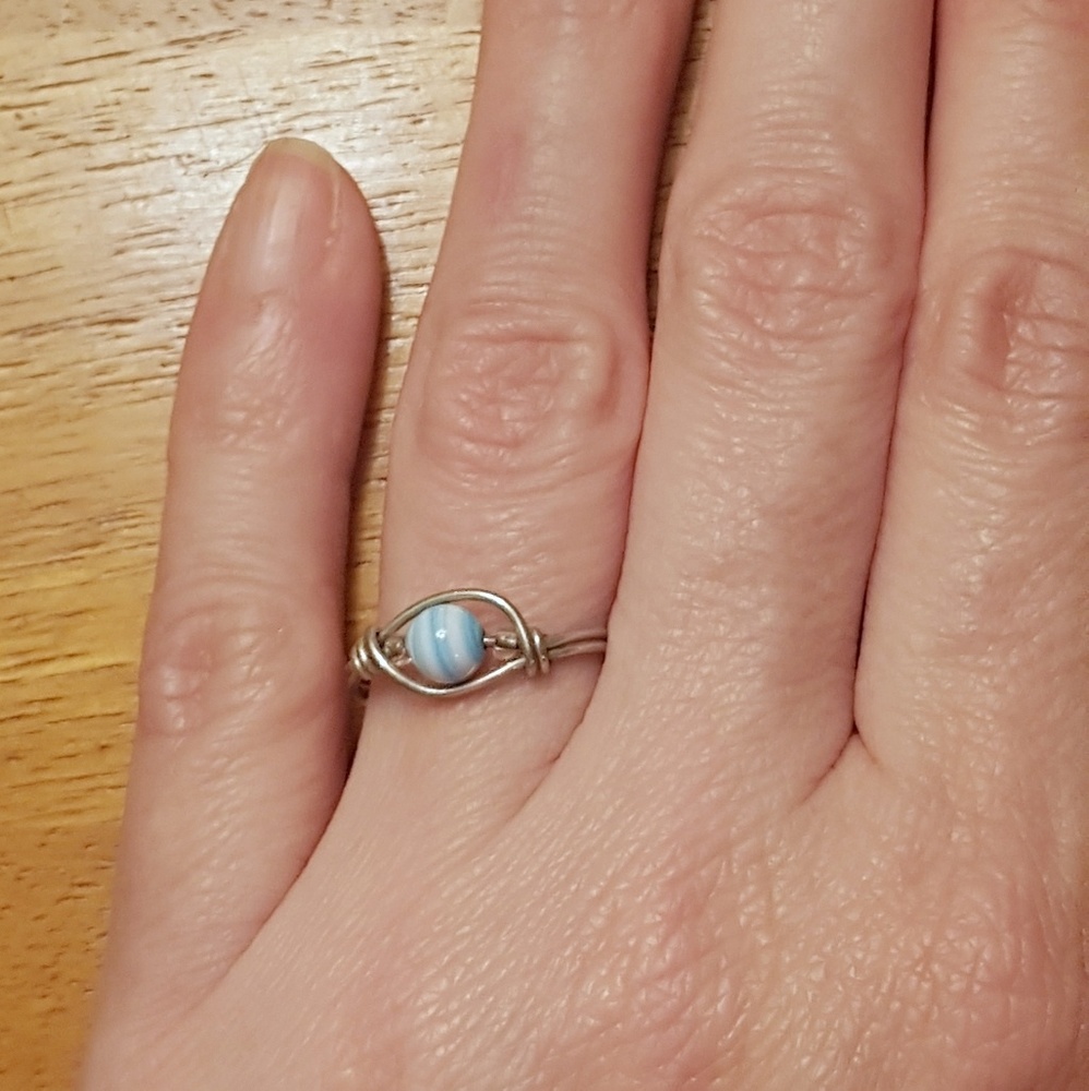 Silver wire wrap ring with blue & white bead